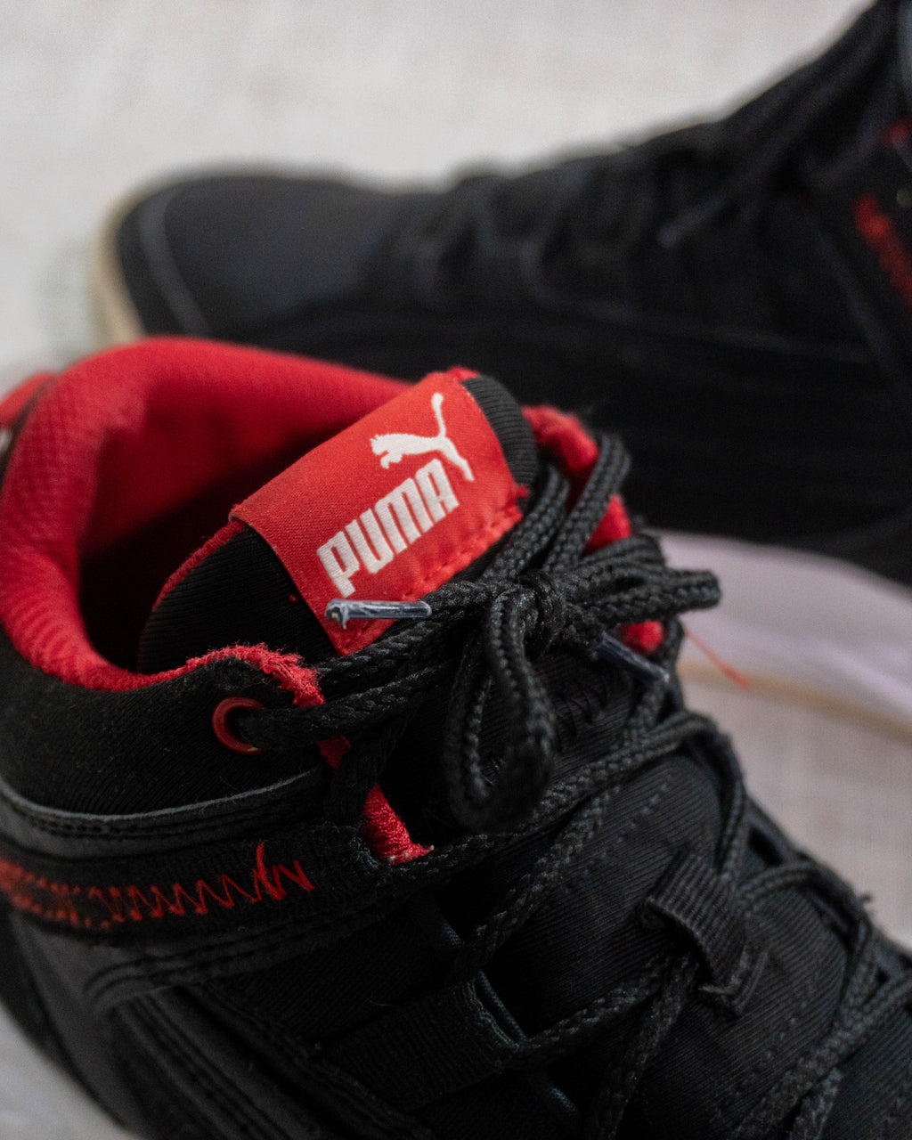 Puma Rebound Future Evo black red sneakers Pakistan original
